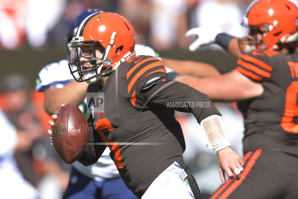 David Richard Cleveland Browns quarterback Baker Mayfield rushes for a 10-yard touchdown during the first half of an NFL football game against the Seattle Seahawks, Sunday, Oct. 13, 2019, in Cleveland. (AP Photo/David Richard)