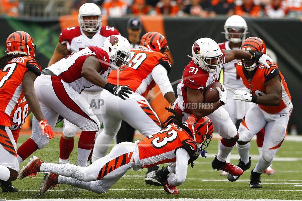 Gary Landers Arizona Cardinals running back David Johnson (31) runs the ball against Cincinnati Bengals cornerback B.W. Webb (23) in the second half of an NFL football game, Sunday, Oct. 6, 2019, in Cincinnati. (AP Photo/Gary Landers)