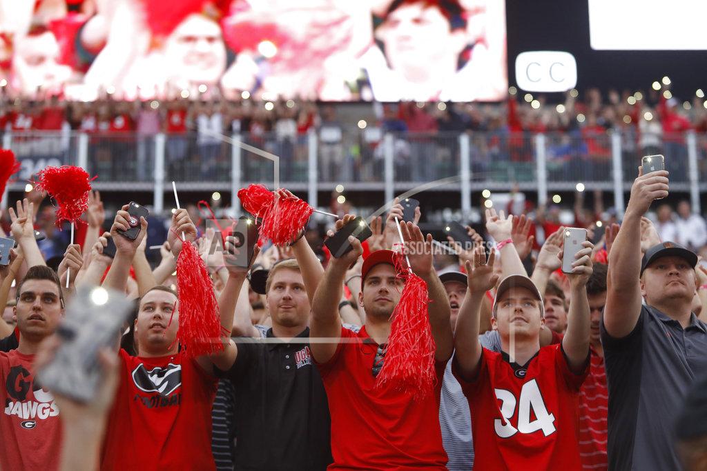 Joshua L. Jones Georgia fans light up the crowed as the game goes into the fourth during the second half of an NCAA college football game between Georgia and Florida at in Jacksonville, Fla. Saturday, Oct. 27, 2018. (Joshua L. Jones/Athens Banner-Herald via AP)