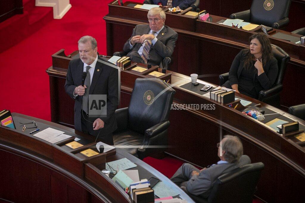 Robert Willett N.C. Senate President Pro Tempore Phil Berger honors former N.C. Senate President Pro Tempore Marc Basnight, before Basnight's portrait was unveiled on Tuesday, September 20, 2021 at the General Assembly in Raleigh, N.C. (Robert Willett/The News & Observer via AP)