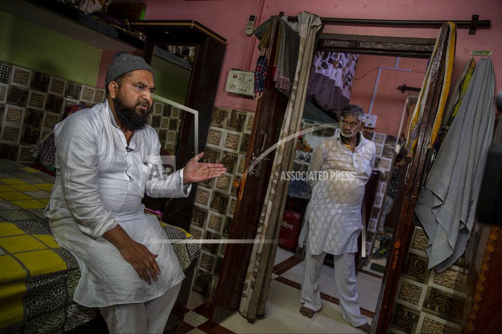 Altaf Qadri Haroon, who saw his 32 year-old brother being shot and killed by his Hindu neighbors during the February 2020 communal riots, speaks to the Associated Press inside his home in North Ghonda, one of the worst riot affected neighborhood, in New Delhi, India, Friday, Feb. 19, 2021. As the first anniversary of bloody communal riots that convulsed the Indian capital approaches, Muslim victims are still shaken and struggling to make sense of their struggle to seek justice. (AP Photo/Altaf Qadri)