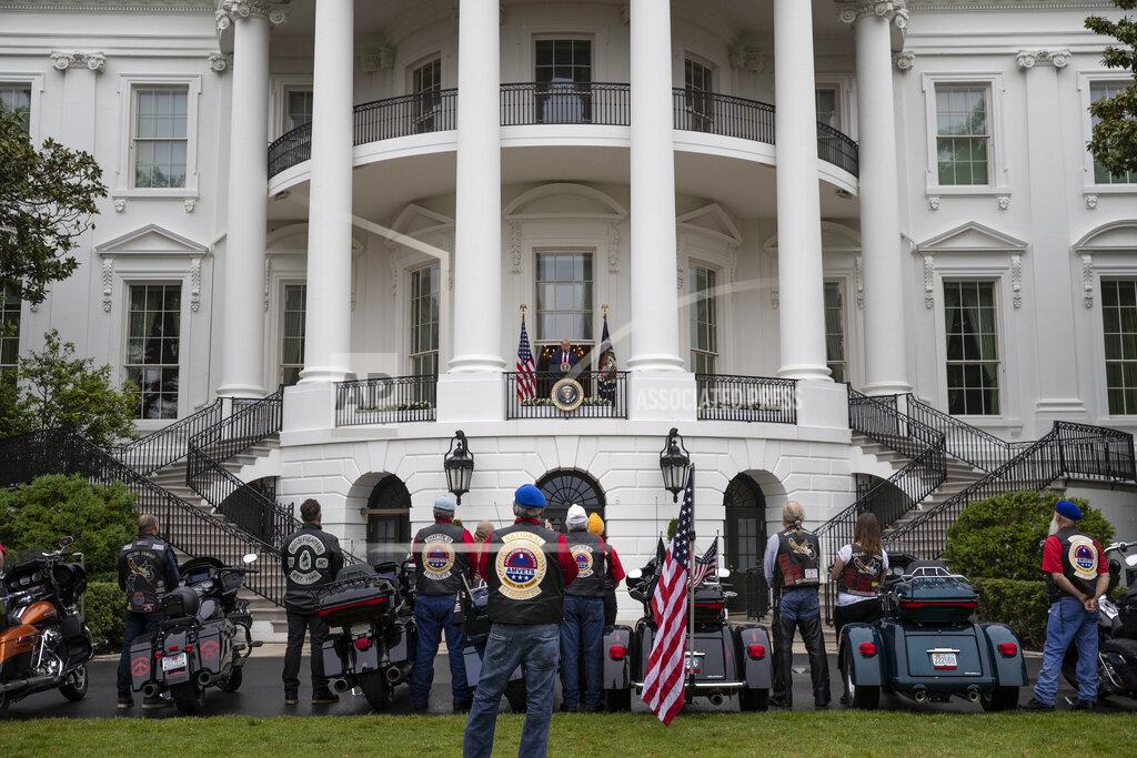 President Donald Trump speaks during a "Rolling to Remember Ceremony," to honor the nation's veterans and POW/MIA, from the Truman Balcony of the White House, Friday, May 22, 2020, in Washington. (AP Photo/Alex Brandon)