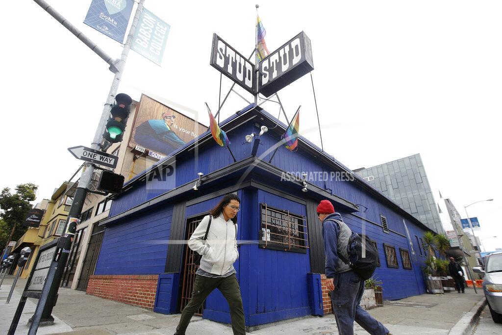 Jeff Chiu FILE - This July 6, 2016, file photo shows pedestrians walking in front of The Stud bar in San Francisco. The Stud, one of the nation's most celebrated gay bars, is being forced from its home amid the financial fallout of the coronavirus pandemic. (AP Photo/Jeff Chiu, File)