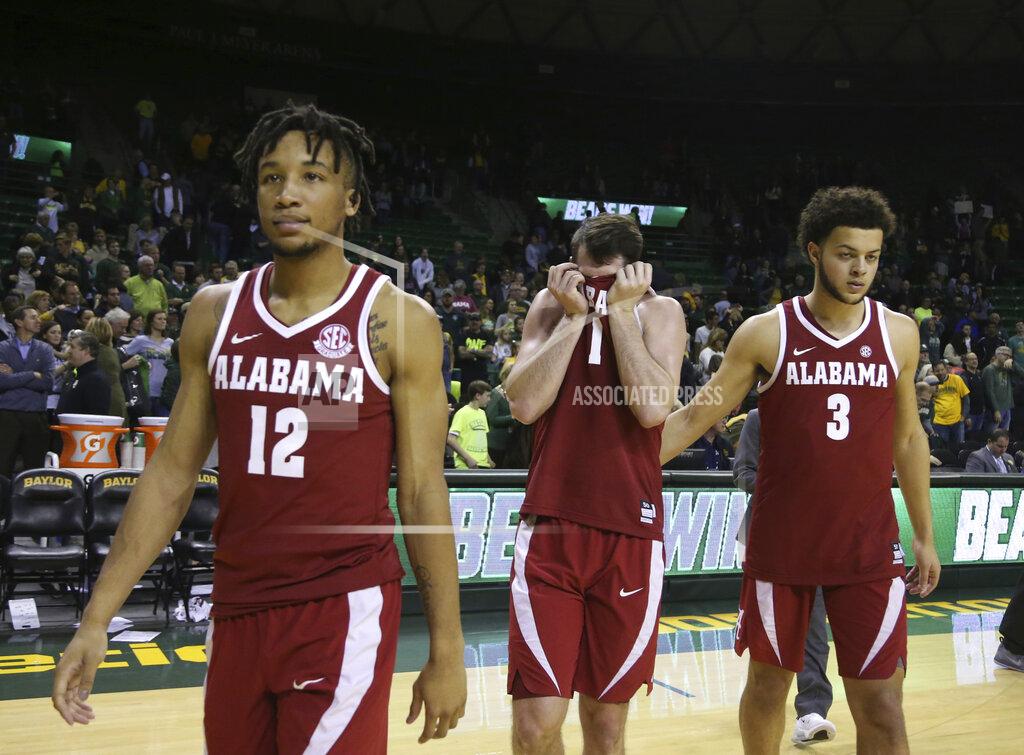Rod Aydelotte FILE - In this Jan. 26, 2019, file photo, Alabama guard Riley Norris, center, reacts to their loss against Baylor while walking off the court with guard Dazon Ingram, left, and forward Alex Reese, right, following an NCAA college basketball game, in Waco, Texas. Alabama has beaten one Top 5 team and pushed another down to the wire on the road and also suffered some humbling defeats. That inconsistency has left the Crimson Tide (15-11, 6-7 Southeastern Conference) in a precarious position in the team’s bid to make a second straight NCAA Tournament. (Rod Aydelotte/Waco Tribune-Herald via AP, File)