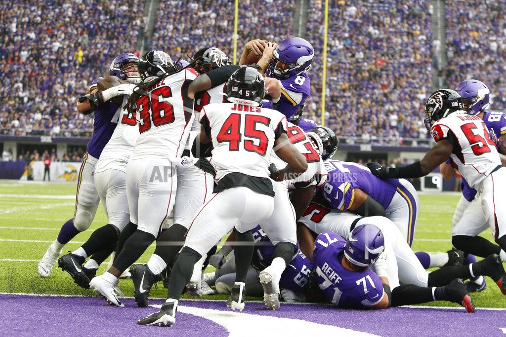Bruce Kluckhohn Minnesota Vikings quarterback Kirk Cousins (8) scores on a 1-yard touchdown run during the first half of an NFL football game against the Atlanta Falcons, Sunday, Sept. 8, 2019, in Minneapolis. (AP Photo/Bruce Kluckhohn)