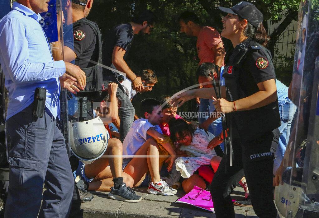 Ali Unal People are detained during the LGBTQ Pride March in Ankara, Turkey, Tuesday, July 5, 2022. Police in Turkey’s capital have broken up a LGBTQ Pride march and detained dozens of people. Turkish authorities have banned LGBTQ events. (AP Photo/Ali Unal)