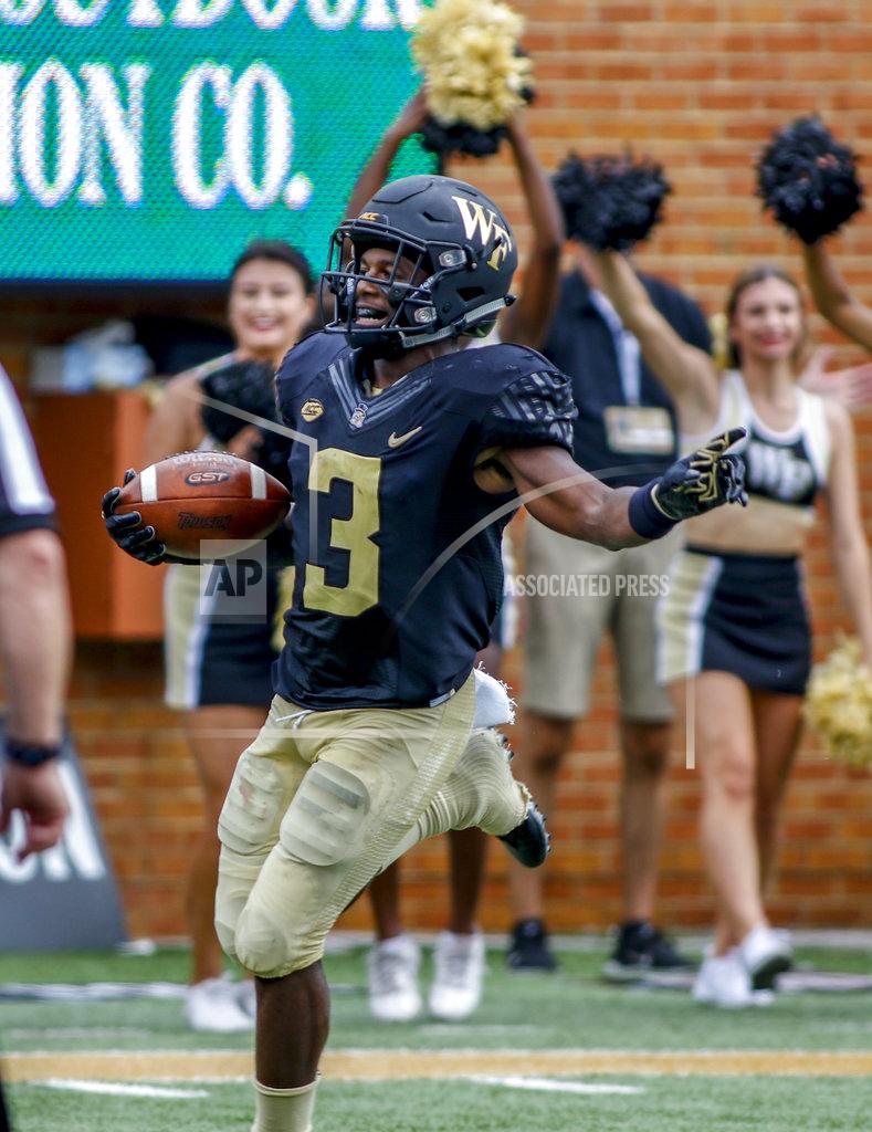 Nell Redmond FILE - In this Sept. 8, 2018, file photo, Wake Forest punt returner Greg Dortch reacts after scoring a touchdown on a punt return against Towson in the first half of a NCAA college football game, in Winston-Salem, N.C. Dortch was named to The Associated Press Midseason All-America team, Tuesday, Oct. 16, 2018. (AP Photo/Nell Redmond, File)