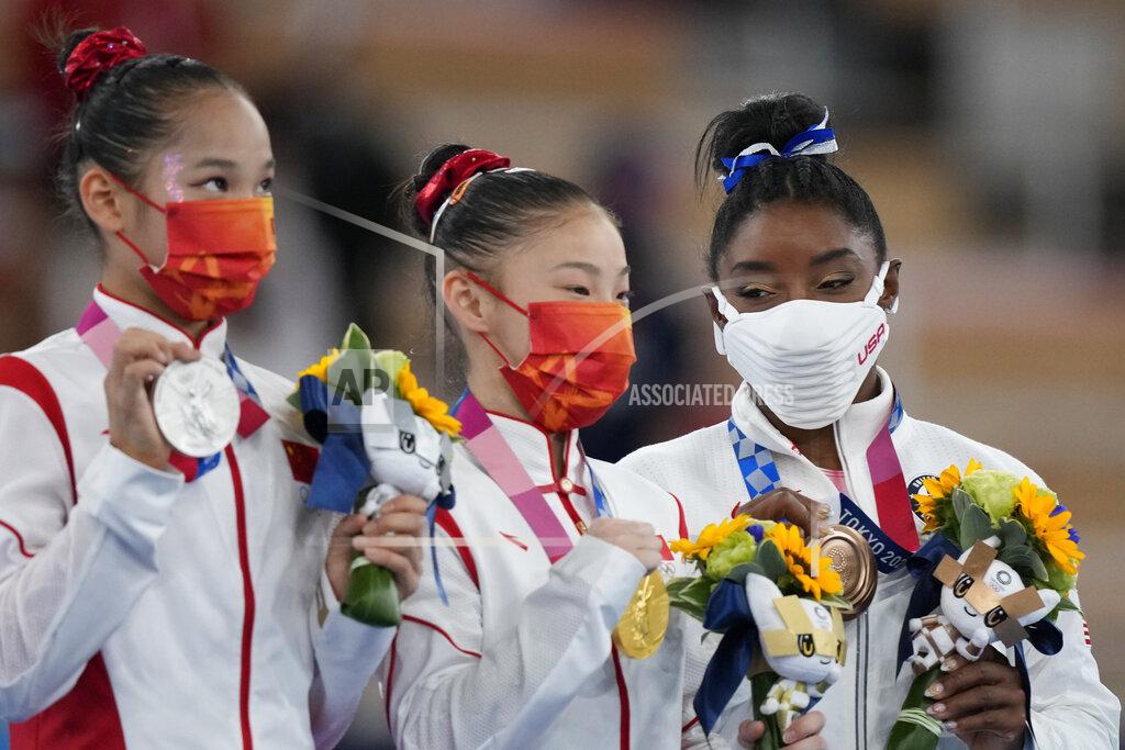 Natacha Pisarenko From left, silver medallist Tang Xijing, of China, gold medallist Guan Chenchen, of China, and bronze medallist Simone Biles, of the United States, pose with their medals for the balance beam during the artistic gymnastics women's apparatus final at the 2020 Summer Olympics, Tuesday, Aug. 3, 2021, in Tokyo, Japan. (AP Photo/Natacha Pisarenko)