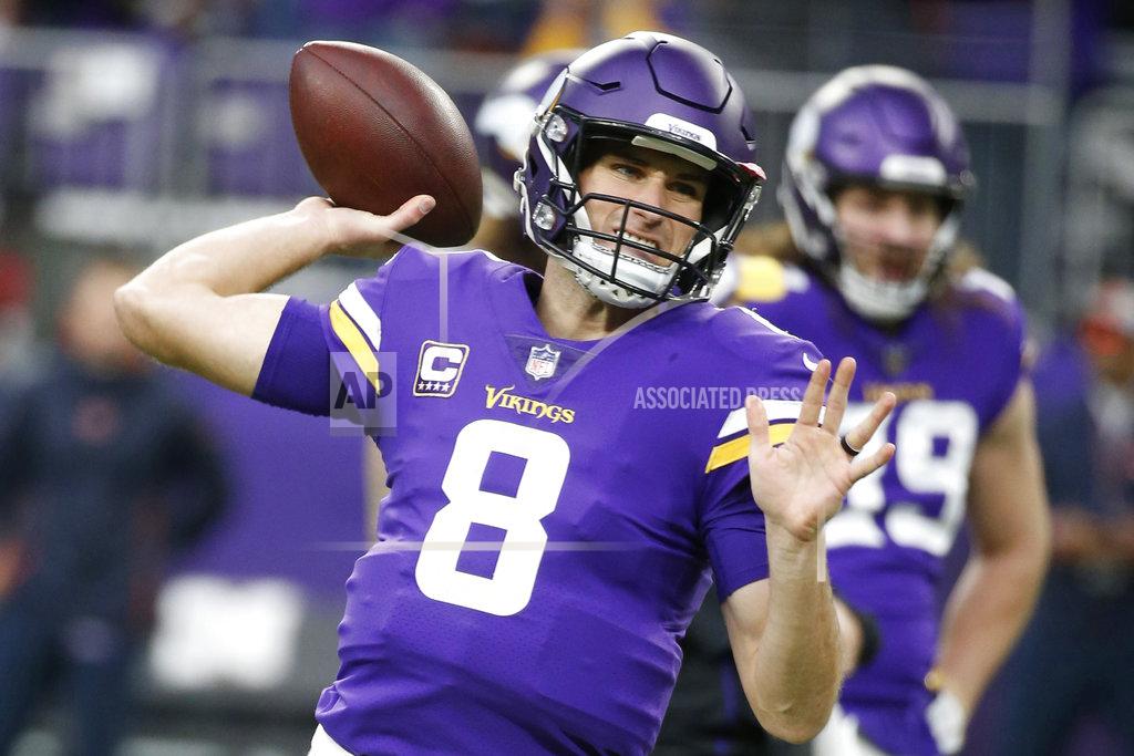 Bruce Kluckhohn FILE - In this Sunday, Dec. 30, 2018 file photo, Minnesota Vikings quarterback Kirk Cousins warms up before an NFL football game against the Chicago Bears, Sunday, Dec. 30, 2018, in Minneapolis. Giving quarterbacks big money doesn't guarantee success or even playoff appearances. The NFL's six highest-paid quarterbacks in 2018 will be spectators this postseason. Green Bay's Aaron Rodgers ($33.5 million), Atlanta's Matt Ryan ($30 million), Minnesota's Kirk Cousins ($28 million), San Francisco's Jimmy Garoppolo ($27.5 million), Detroit's Matthew Stafford ($27 million) and Oakland's Derek Carr ($25 million) couldn't lead their teams to the playoffs. (AP Photo/Bruce Kluckhohn, File)
