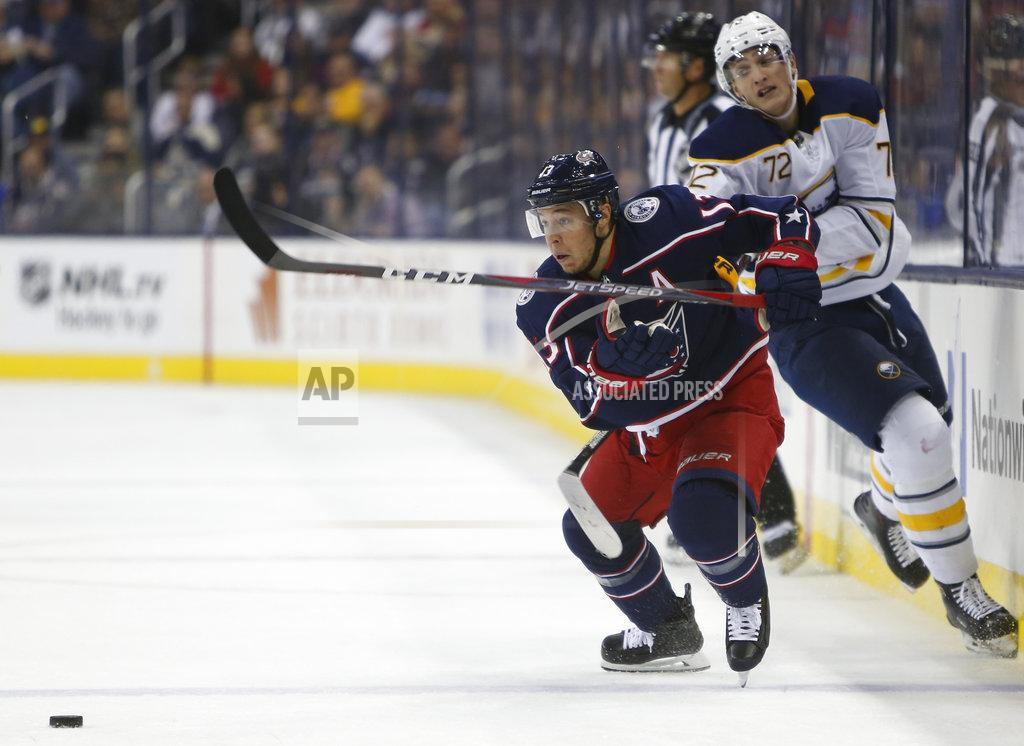 Jay Laprete Columbus Blue Jackets' Cam Atkinson, left, carries the puck across the blue line past Buffalo Sabres' Tage Thompson during the second period of an NHL hockey game Saturday, Oct. 27, 2018, in Columbus, Ohio. (AP Photo/Jay LaPrete)