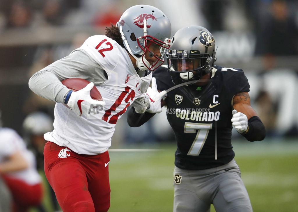 David Zalubowski Washington State wide receiver Dezmon Patmon, left, is tackled by Colorado defensive back Nick Fisher after pulling in a pass in the second half of an NCAA college football game Saturday, Nov. 10, 2018, in Boulder, Colo. Washington State won 31-7. (AP Photo/David Zalubowski)