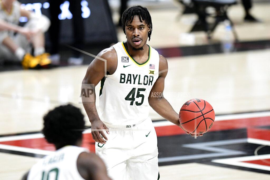 Justin Rex Baylor's Davion Mitchell (45) controls the ball during the first half of an NCAA college basketball game against Texas Tech in Lubbock, Texas, Saturday, Jan. 16, 2021. (AP Photo/Justin Rex)