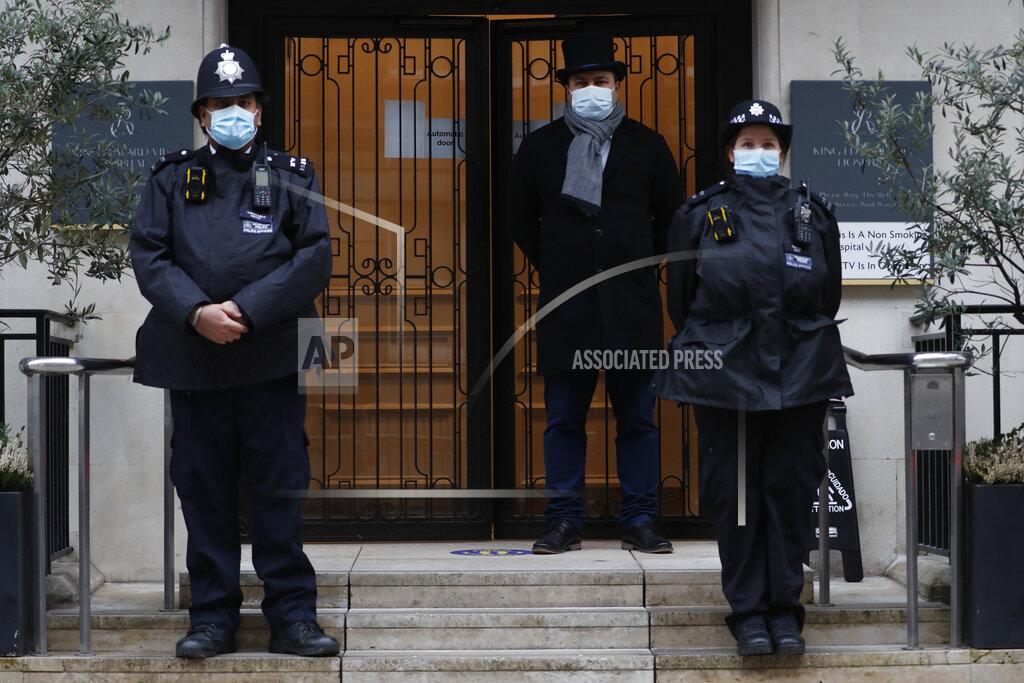 Alastair Grant Police stand guard outside the King Edward VII hospital In London, Monday, Feb. 22, 2021, where Britain's Prince Philip is being treated. Prince Philip, 99, was admitted to the hospital on Tuesday on the advice of his doctor in what Buckingham Palace described as “a precautionary measure.” (AP Photo/Alastair Grant)