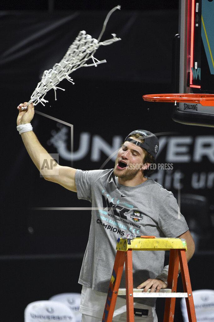 David Becker Gonzaga forward Corey Kispert swings the net after Gonzaga defeated BYU in an NCAA college basketball game for the West Coast Conference men's tournament championship Tuesday, March 9, 2021, in Las Vegas. (AP Photo/David Becker)