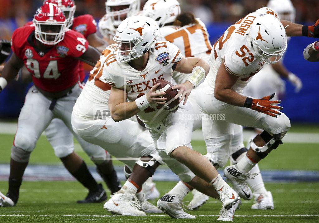 Rusty Costanza Texas quarterback Sam Ehlinger (11) scrambles during the first half of the Sugar Bowl NCAA college football game against Georgia in New Orleans, Tuesday, Jan. 1, 2019. (AP Photo/Rusty Costanza)