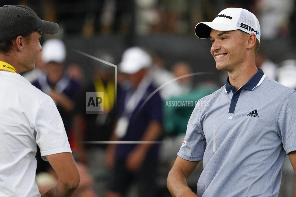 Andrew Medichini Nicolai Hojgaard of Denmark, right, smiles at his twin brother Rasmus after winning the Italian Open golf tournament, in Guidonia, in the outskirts of Rome, Sunday, Sept. 5, 2021. The Italian Open took place on the redesigned Marco Simone course just outside Rome that will host the 2023 Ryder Cup.(AP Photo/Andrew Medichini)