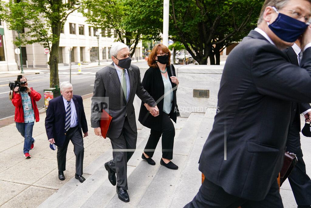 Matt Rourke Former Penn State President Graham Spanier, center, arrives for a hearing at the Dauphin County Courthouse in Harrisburg, Pa., Wednesday, May 26, 2021. A judge will determine if and when Spanier must report to jail to begin serving time for a single misdemeanor conviction of endangering the welfare of children. (AP Photo/Matt Rourke)