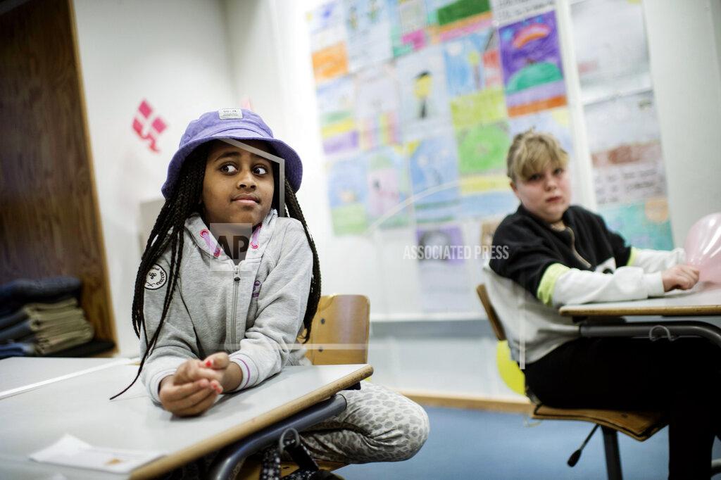 Tim Kildeborg Jensen Third grade students in a lesson, at Tved School, in Svendborg, on the island of Funen, Denmark, Monday, Feb. 8, 2021. Students in the lower grades returned to the classrooms after schools were closed in an effort to control the spread of coronavirus. Denmark's Prime Minister Mette Frederiksen said Monday it was uncertain when older students would return to school. (Tim Kildeborg Jensen/Ritzau Scanpix via AP)