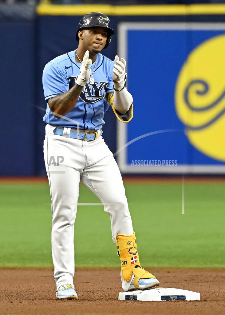 Steve Nesius Tampa Bay Rays' Wander Franco claps on second base after hitting a double off Miami Marlins starter Jesus Luzardo during the first inning of a baseball game Sunday, Sept. 26, 2021, in St. Petersburg, Fla. Franco extended his on-base consecutive game streak to 41. (AP Photo/Steve Nesius)