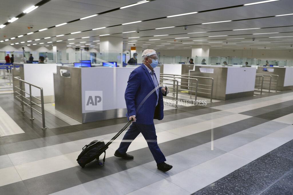 Bilal Hussein A passenger arrives at the Rafik Hariri International Airport in Beirut, Lebanon, Wednesday, July 1, 2020. Beirut's airport is partially reopening after a three-month shutdown and Lebanon's cash-strapped government is hoping that thousands of Lebanese expatriates will return for the summer, injecting dollars into the country's sinking economy. (AP Photo/Bilal Hussein)