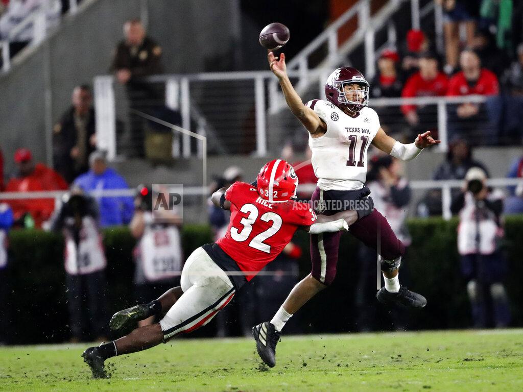 John Bazemore Texas A&M quarterback Kellen Mond (11) throws under pressure from Georgia linebacker Monty Rice (32) in the second half of an NCAA college football game Saturday, Nov. 23, 2019, in Athens, Ga. Georgia won 19-13. (AP Photo/John Bazemore)