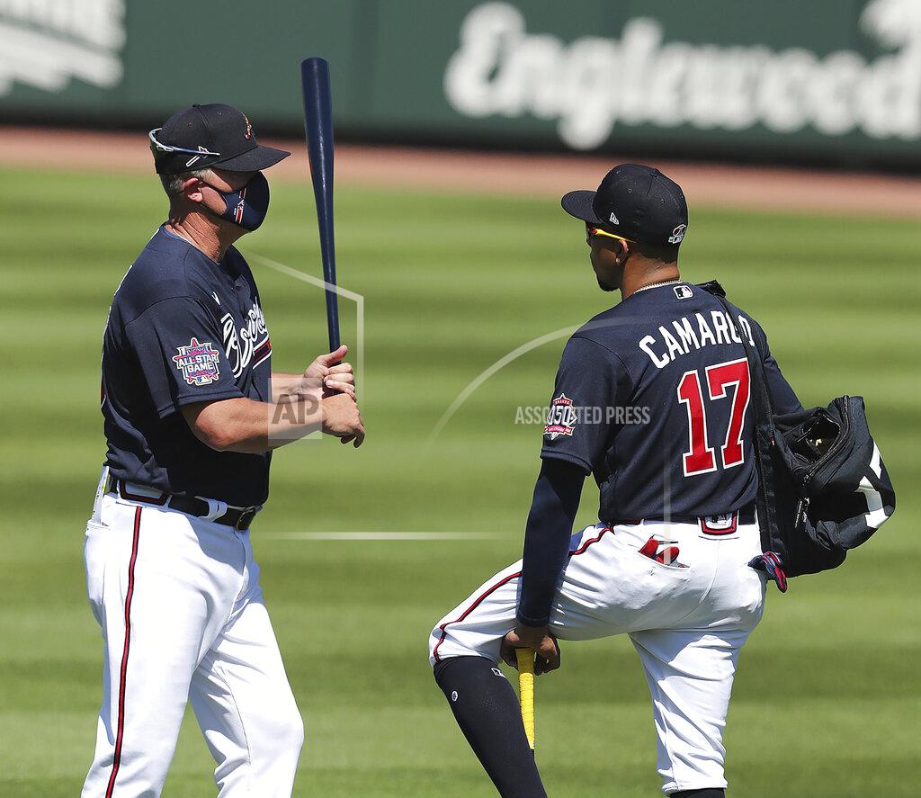 Curtis Compton Atlanta Braves Hall of Famer Chipper Jones, left, gives infielder Johan Camargo some batting tips during spring baseball training Tuesday, Feb. 23, 2021, in North Port, Fla. (Curtis Compton/Atlanta Journal-Constitution via AP)