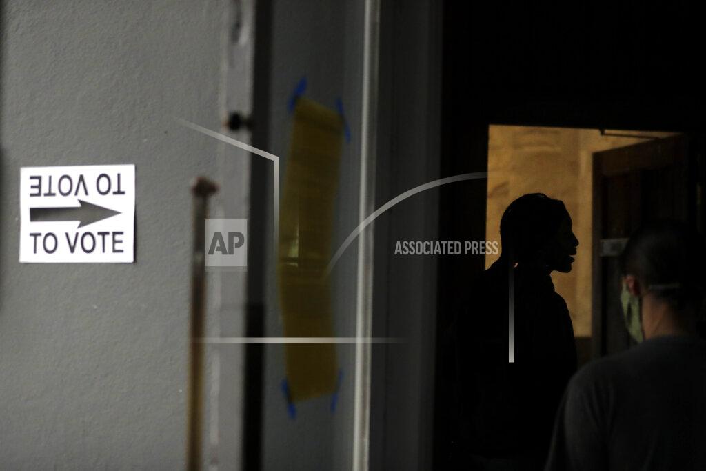 Brynn Anderson People wait in line to vote in the Georgia's primary election at Park Tavern on Tuesday, June 9, 2020, in Atlanta. (AP Photo/Brynn Anderson)