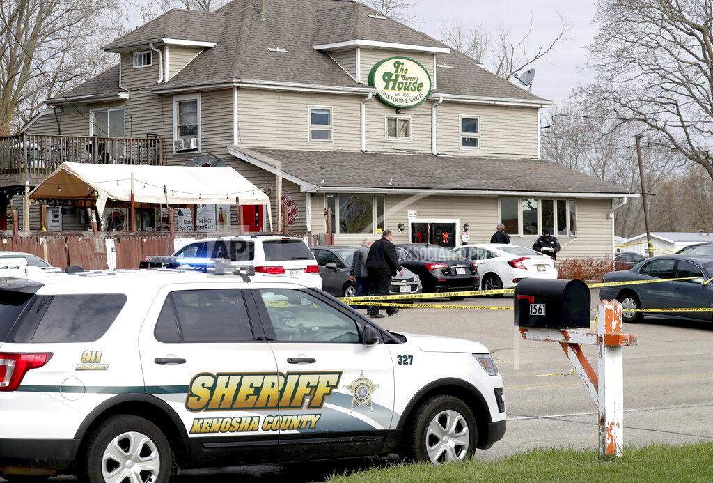 Mike De Sisti Officials investigate the scene a deadly shooting at Somers House Tavern in Kenosha, Wis., Sunday, April 18, 2021. Several people were killed and two were seriously wounded in a shooting at the busy tavern in southeastern Wisconsin early Sunday, sheriff's officials said. (Mike De Sisti/Milwaukee Journal-Sentinel via AP)