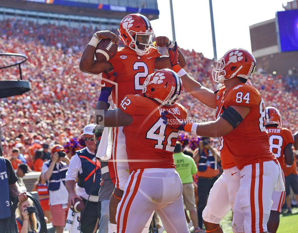 Richard Shiro Clemson's Kelly Bryant (2) celebrates a touchdown with Christian Wilkins (42) and Cannon Smith during the first half of an NCAA college football game against Boston College, Saturday, Sept. 23, 2017, in Clemson, S.C. (AP Photo/Richard Shiro)