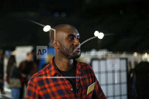 FILE - Designer Virgil Abloh walks backstage prior to his Off-White ready to wear Fall-Winter 2019-2020 collection, that was presented in Paris, Thursday, Feb. 28, 2019. Abloh, a leading fashion executive hailed as the Karl Lagerfeld of his generation, has died after a private battle with cancer. He was 41. Abloh’s death was announced Sunday, Nov. 28, 2021 by LVMH Louis Vuitton and the Off White label, the brand he founded. (AP Photo/Thibault Camus, File )