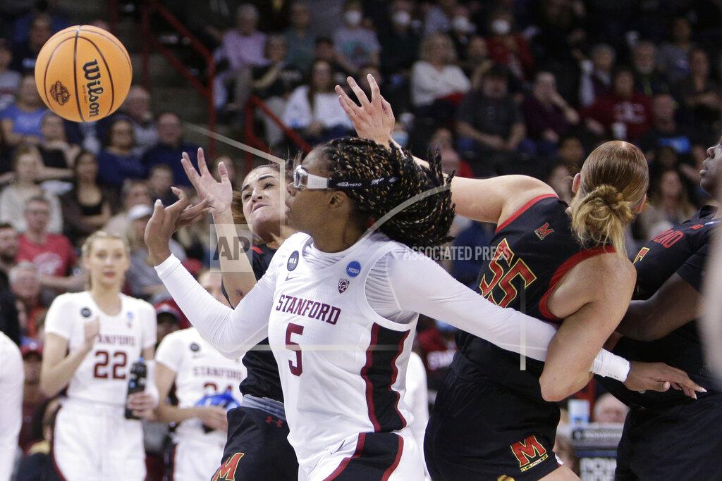 Young Kwak Stanford forward Francesca Belibi (5) battles with Maryland guard Katie Benzan, left, and forward Chloe Bibby (55) for a loose ball during the second half of a college basketball game in the Sweet 16 round of the NCAA tournament, Friday, March 25, 2022, in Spokane, Wash. (AP Photo/Young Kwak)