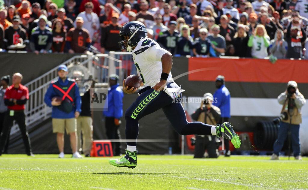 Ron Schwane Seattle Seahawks quarterback Russell Wilson rushes for a 16-yard touchdown during the first half of an NFL football game against the Cleveland Browns, Sunday, Oct. 13, 2019, in Cleveland. (AP Photo/Ron Schwane)