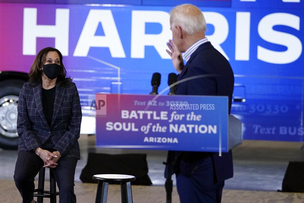 Carolyn Kaster Democratic presidential candidate former Vice President Joe Biden gestures to his running mate, Democratic vice presidential candidate Sen. Kamala Harris, D-Calif., at the Carpenters Local Union 1912 in Phoenix, Thursday, Oct. 8, 2020, to kick off a small business bus tour. (AP Photo/Carolyn Kaster)