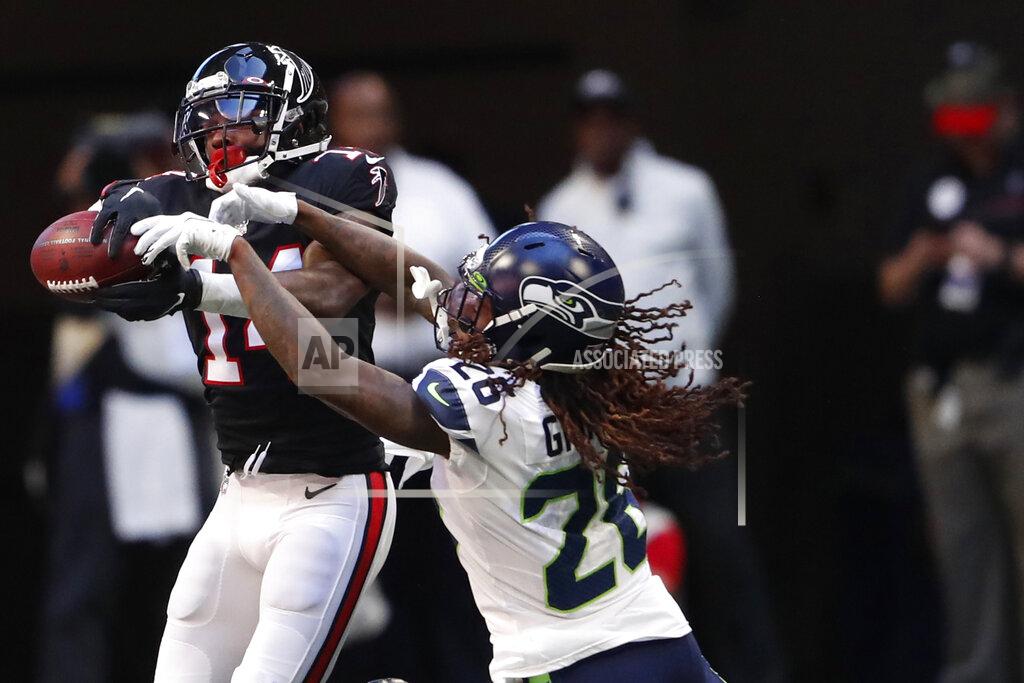 John Bazemore Atlanta Falcons wide receiver Justin Hardy (14) makes the catch against Seattle Seahawks cornerback Shaquill Griffin (26) during the first half of an NFL football game, Sunday, Oct. 27, 2019, in Atlanta. (AP Photo/John Bazemore)