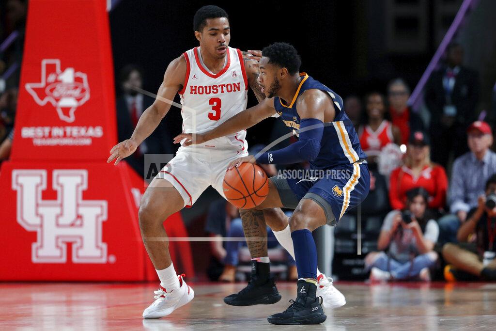 Michael Wyke Northern Colorado guard Matt Johnson II, right, tries to drive around Houston guard Ramon Walker Jr. (3) during the second half of an NCAA college basketball game Monday, Nov. 7, 2022, in Houston. (AP Photo/Michael Wyke)