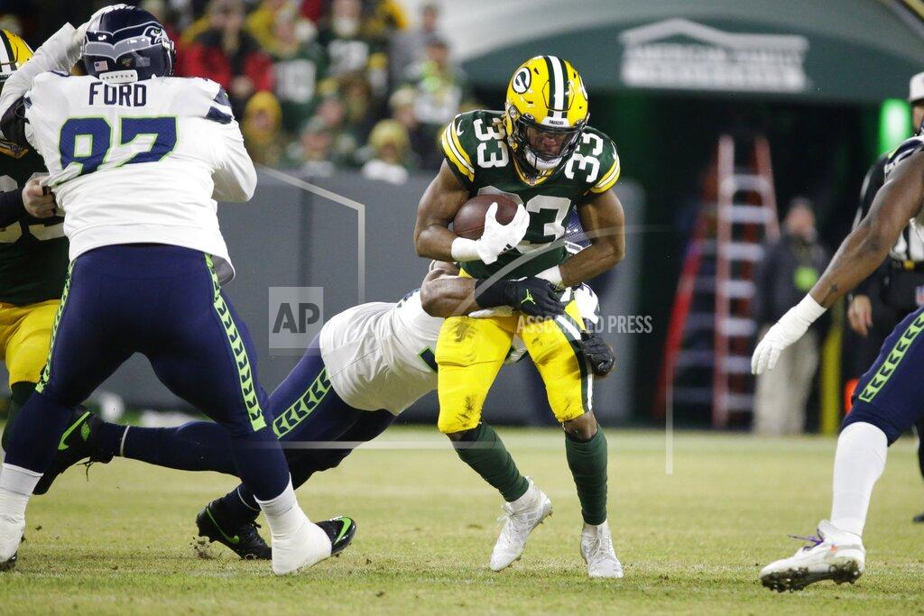 Mike Roemer Green Bay Packers' Aaron Jones runs during the first half of an NFL divisional playoff football game against the Seattle Seahawks Sunday, Jan. 12, 2020, in Green Bay, Wis. (AP Photo/Mike Roemer)
