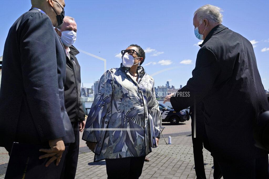 Seth Wenig FILE - In this May 6, 2021, file photo Housing and Urban Development Secretary Marcia Fudge, center, speaks with people before a news conference in Hoboken, N.J. More than eight years after Superstorm Sandy overwhelmed the New York City area, Hoboken is breaking ground on a flood resiliency project that is part of a $230 million plan funded by the U.S. Department of Housing and Urban Development. (AP Photo/Seth Wenig, File)