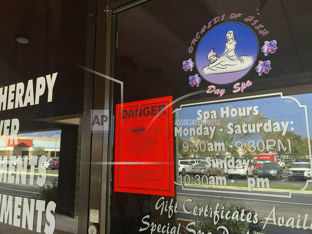 Hannah Morse FILE - In this Feb. 19, 2019, file photo, a sign is posted outside of Orchids of Asia Day Spa in Jupiter, Fla., one of several spas closed in south Florida as a result of a six-month investigation into sex trafficking. The Florida prostitution sting that ensnared New England Patriots owner Robert Kraft is a reminder of the human trafficking and abuse taking place behind the darkened windows of many of these storefronts, and how challenging those problems can be to address. (Hannah Morse/Palm Beach Post via AP, File)