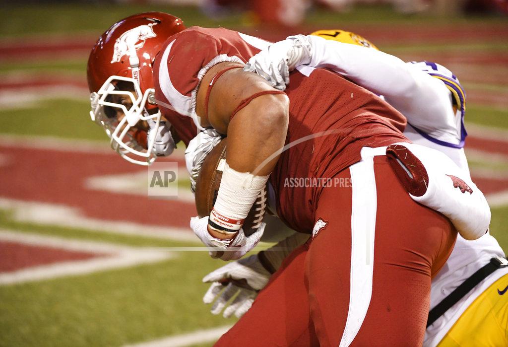 Michael Woods Arkansas tight end Cheyenne O'Grady pushes past LSU defender Greedy Williams to score a touchdown during the second half of an NCAA college football game, Saturday, Nov. 10, 2018, in Fayetteville, Ark. LSU won, 24-17. (AP Photo/Michael Woods)