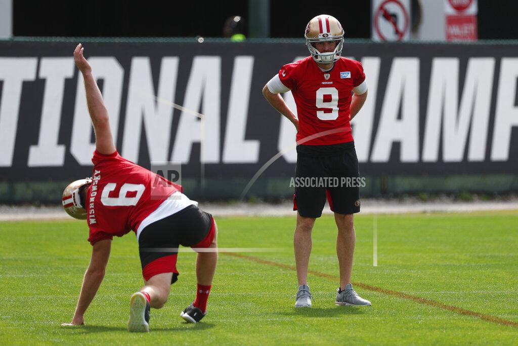 San Francisco 49ers punter Mitch Wishnowsky (6) and kicker Robbie Gould (9) stretch during practice for the NFL Super Bowl 54 football game, Friday, Jan. 31, 2020, in Coral Gables, Fla. (AP Photo/Wilfredo Lee)