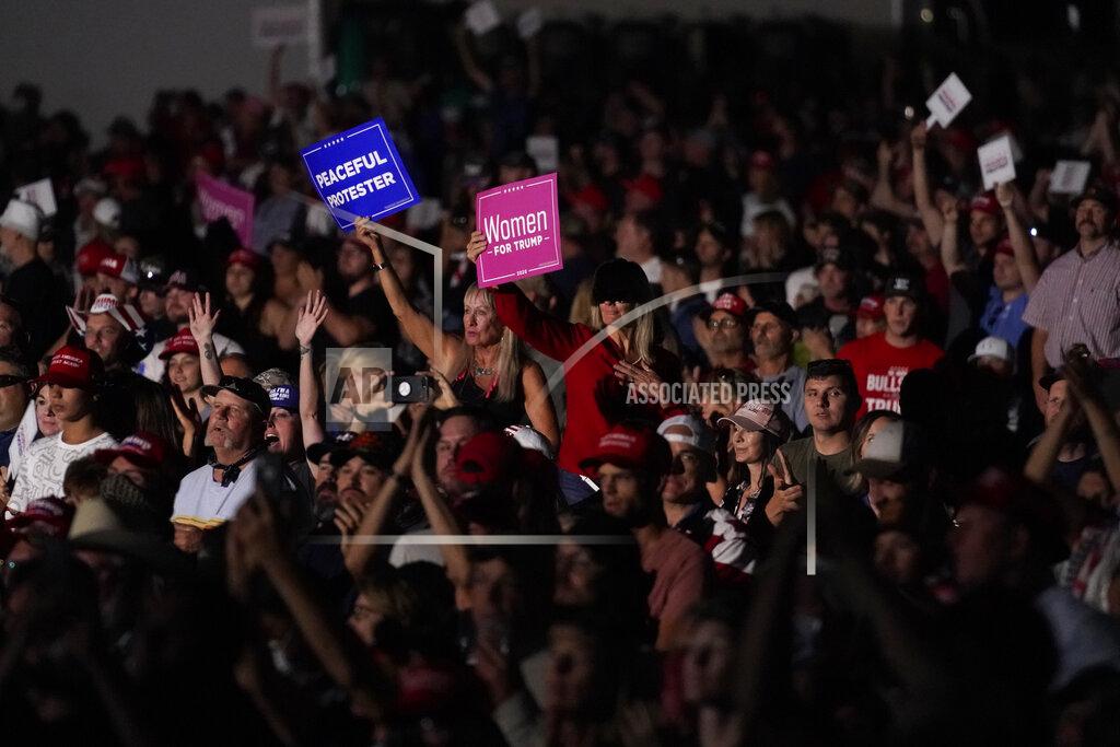Supporters listen as President Donald Trump speaks at a rally at Minden-Tahoe Airport in Minden, Nev., Saturday, Sept. 12, 2020. (AP Photo/Andrew Harnik)