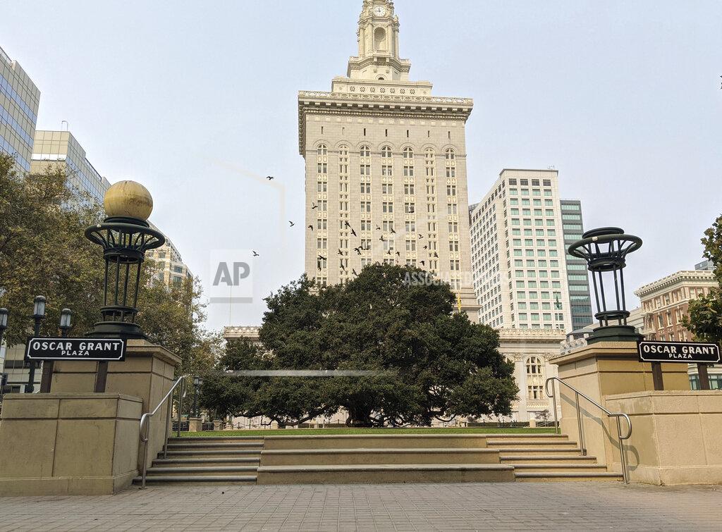 Michael Liedtke This Oct. 1, 2020, photo shows an empty plaza in front of City Hall in downtown Oakland, Calif. As office workers continue to stay home during the pandemic, cities that were in the middle of bustling downtown comebacks are feeling a lot of uncertainty. Places like Detroit, Cleveland or Oakland, California, were seeing big downtown growth before the coronavirus hit. (AP Photo/Michael Liedtke)