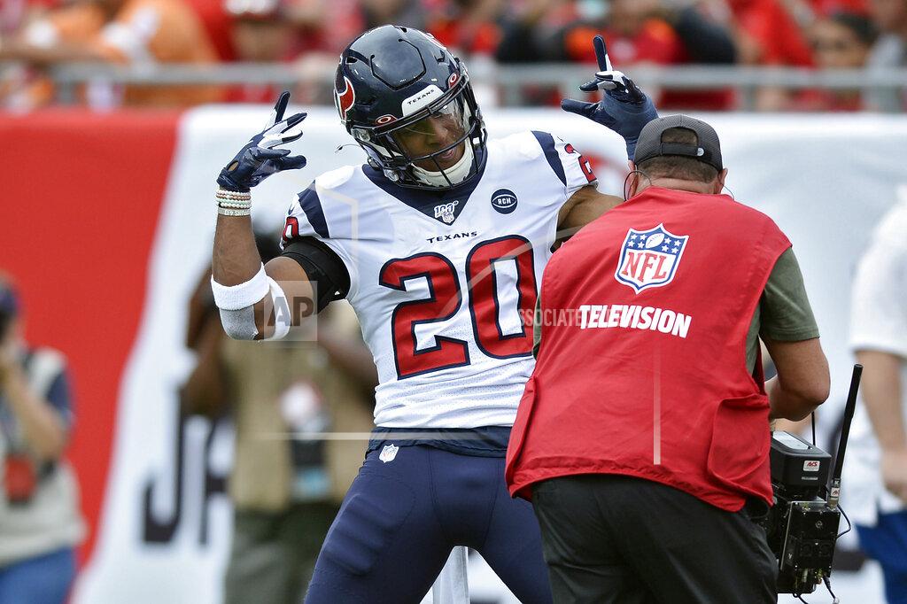 Jason Behnken Houston Texans strong safety Justin Reid (20) celebrates for the cameras after intercepting a pass by Tampa Bay Buccaneers quarterback Jameis Winston during the first half of an NFL football game Saturday, Dec. 21, 2019, in Tampa, Fla. (AP Photo/Jason Behnken)