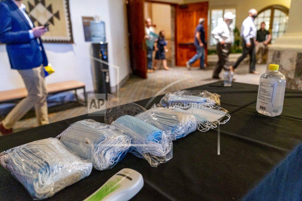 Andrew Harnik Face masks are left on a table outside a Latinos for Trump Coalition Roundtable where President Donald Trump spoke at Arizona Grand Resort & Spa, Monday, Sept. 14, 2020, in Phoenix. (AP Photo/Andrew Harnik)