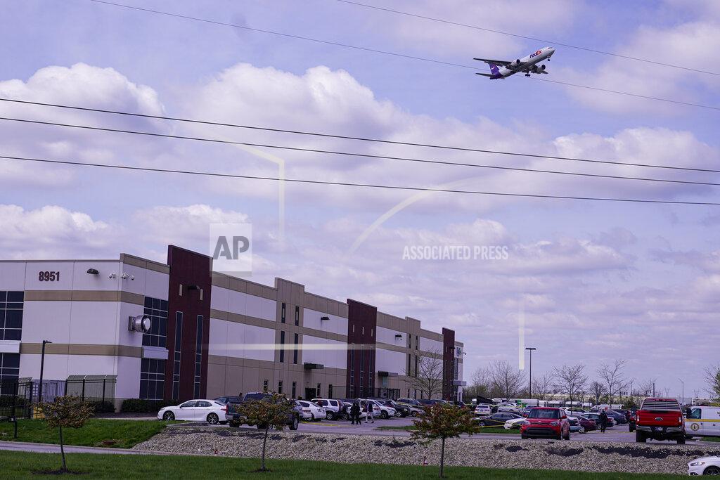 Michael Conroy A FedEx flight on final approach flies over the FexEx Ground facility, Friday, April 16, 2021, in Indianapolis, where multiple people were shot at a FedEx Ground facility near the Indianapolis airport. (AP Photo/Michael Conroy)