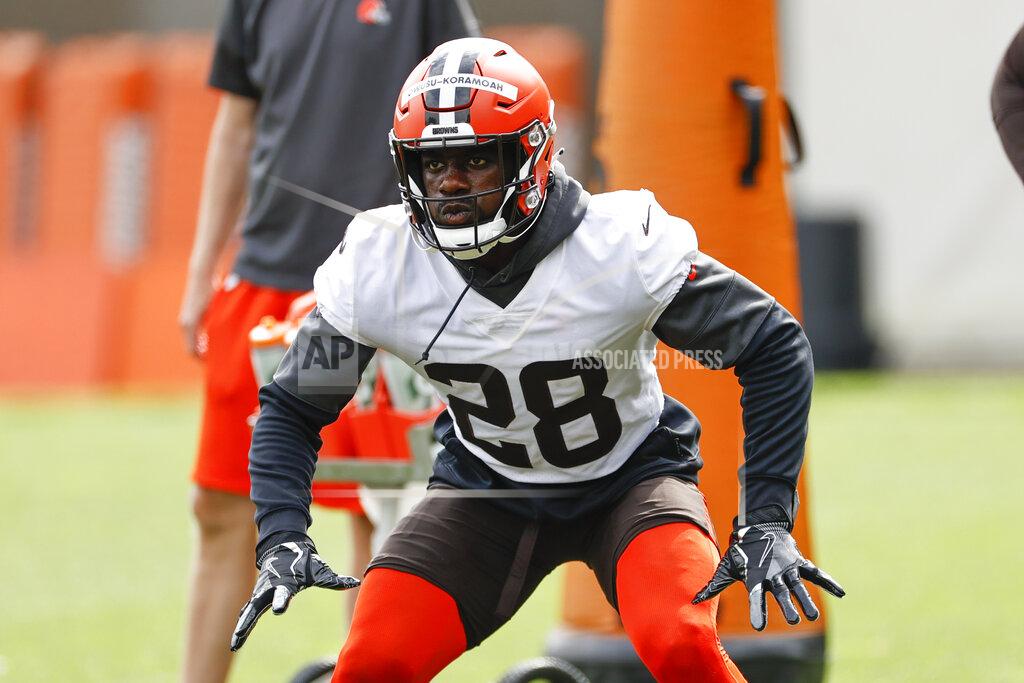FILE - In this Wednesday, June 9, 2021 file photo, Cleveland Browns linebacker Jeremiah Owusu-Koramoah runs through a drill during an NFL football practice at the team's training facility in Berea, Ohio. Cleveland Browns rookie linebacker Jeremiah Owusu-Koramoah has tested positive with the COVID-19 virus just days before the opening of training camp. The team placed the second-round pick from Notre Dame on the COVID list Sunday, July 25, 2021.(AP Photo/Ron Schwane, File)