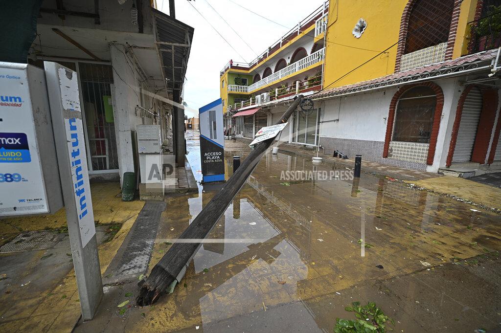 Roberto Echeagaray An electric pole lays on its side after the passing of Hurricane Pamela in Mazatlan, Mexico, Wednesday, Oct. 13, 2021. Pamela made landfall on Mexico's Pacific coast just north of Mazatlan on Wednesday, bringing high winds and rain to the port city. (AP Photo/Roberto Echeagaray)