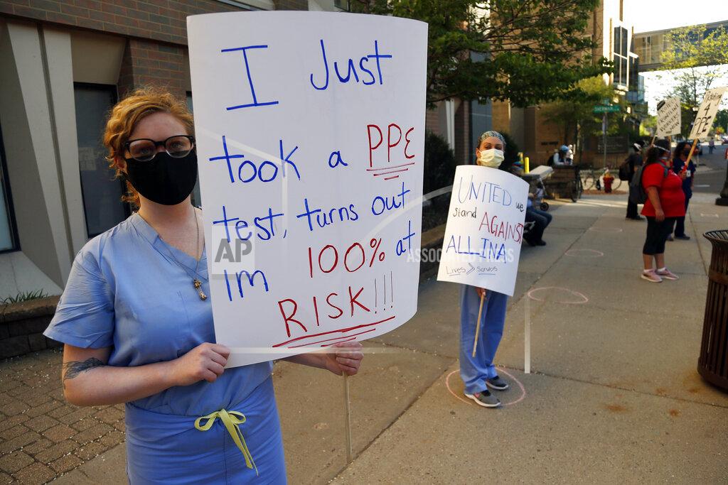 Jim Mone Nurses picket outside United Hospital Wednesday, May 20, 2020 in St. Paul, Minn. as they seek a say in worker protections, increased personal protection resources with higher safety standards, and an end to retaliation against workers who have tried to protect themselves from COVID-19. (AP Photo/Jim Mone)