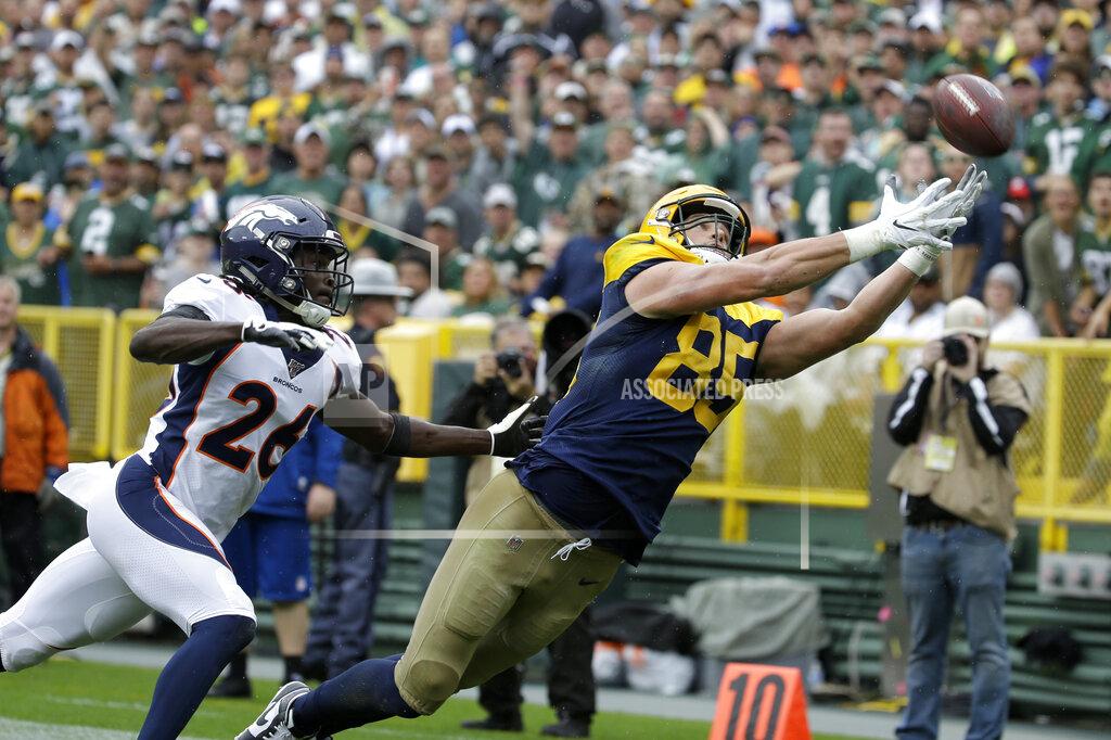 Mike Roemer Green Bay Packers tight end Robert Tonyan (85) is unable to catch a pass as Denver Broncos cornerback Isaac Yiadom (26) defends during the first half of an NFL football game Sunday, Sept. 22, 2019, in Green Bay, Wis. (AP Photo/Mike Roemer)