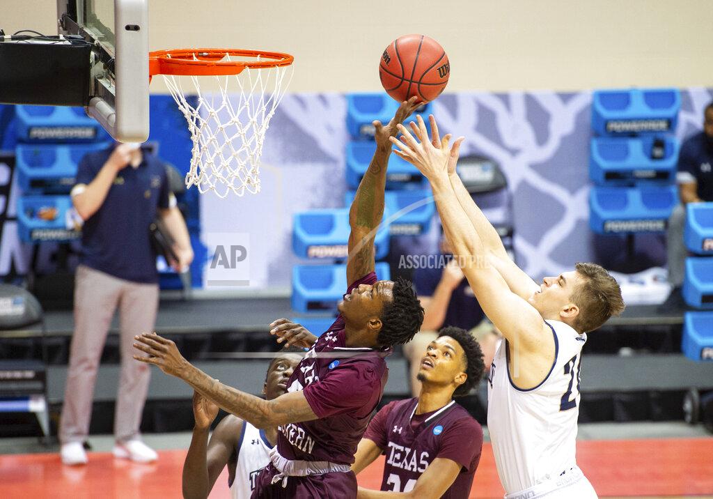 Doug Mcschooler Texas Southern forward Joirdon Karl Nicholas (5), left, and Mount St. Mary's forward Frantisek Barton (24) battle for a rebound during the first half of a First Four game in the NCAA men's college basketball tournament, Thursday, March 18, 2021, in Bloomington, Ind. (AP Photo/Doug McSchooler)